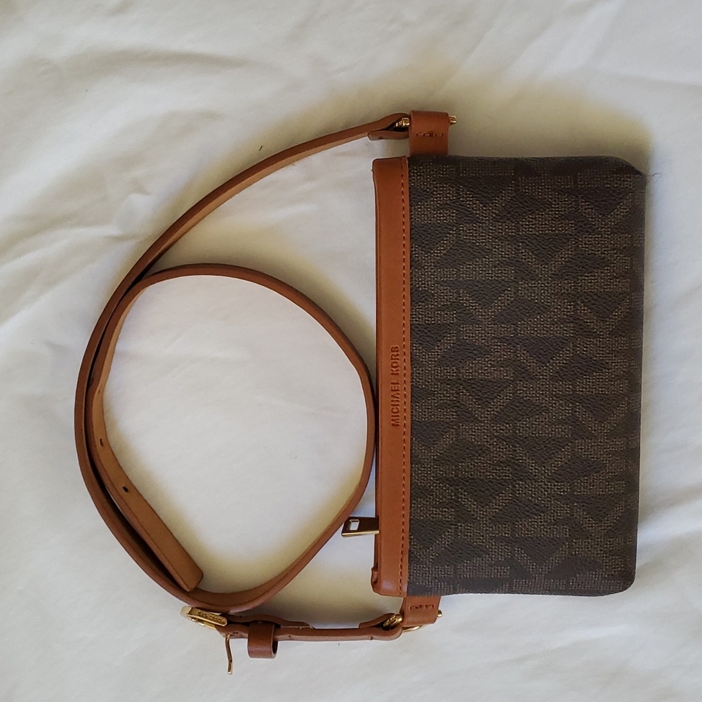 Small, Michael Kors waist bag. With logo design patterns. Length, 7in, Width 4in